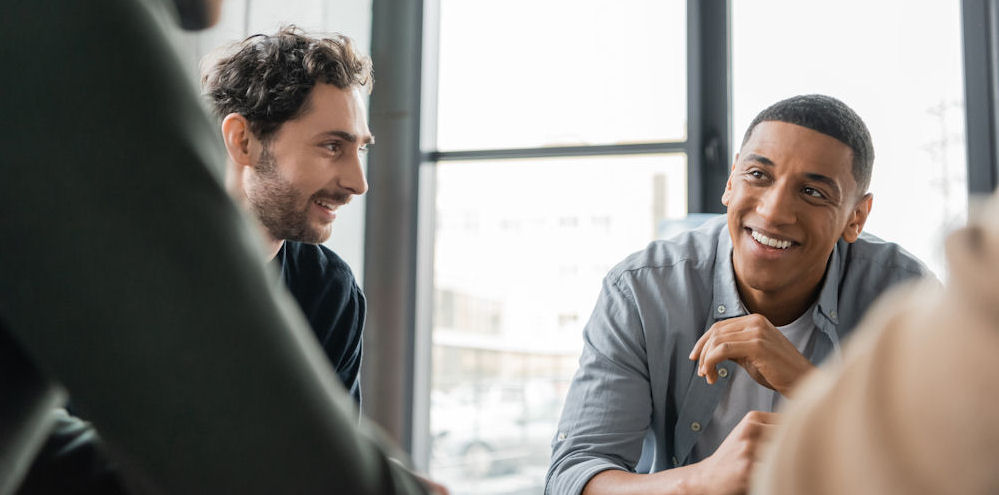 man speaking in small group therapy session