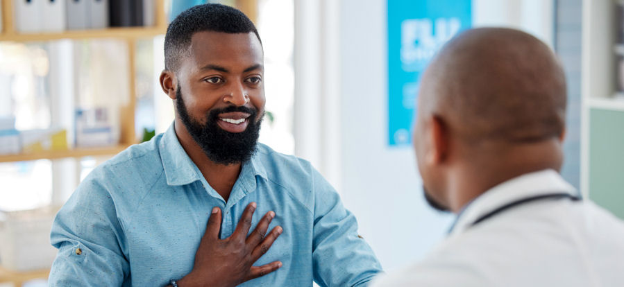 man discussing treatment with healthcare provider