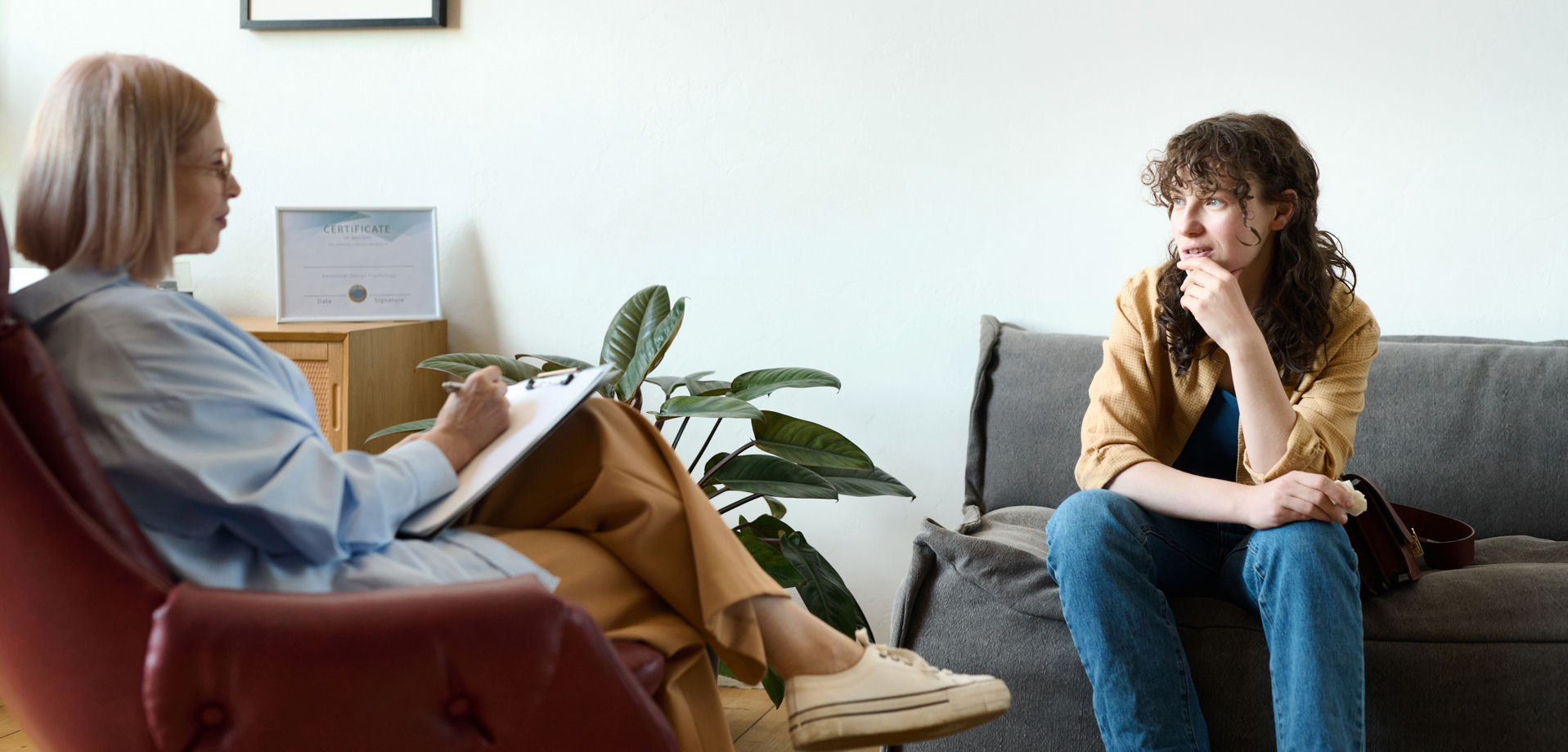 woman sitting on couch for individual therapy