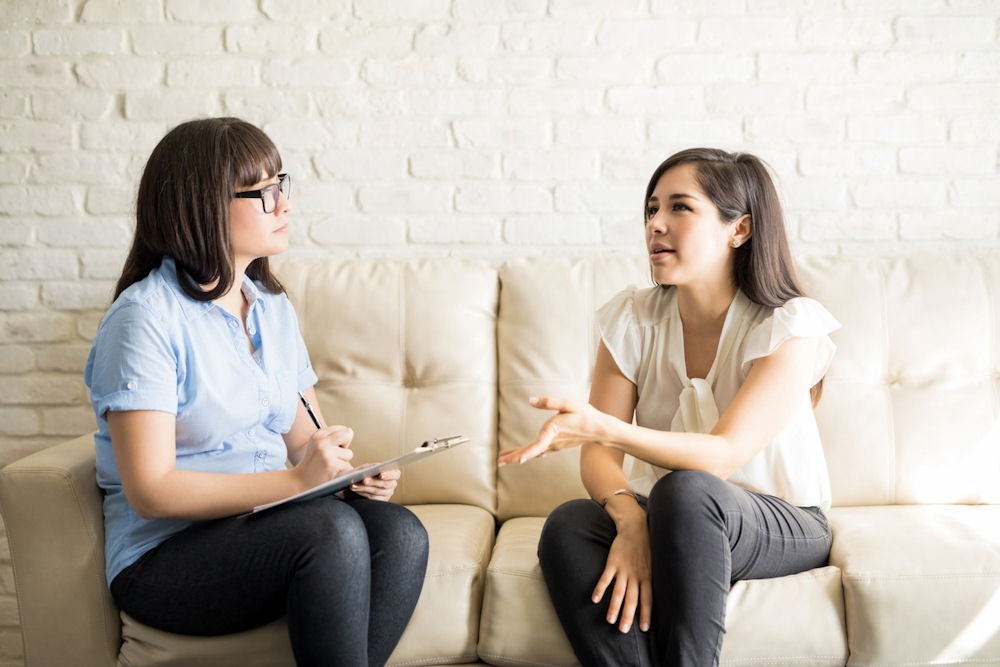 what-is-the-cognitive-triangle Individual therapy session between a therapist and patient